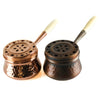 Engraved copper incense burner with wood handle.