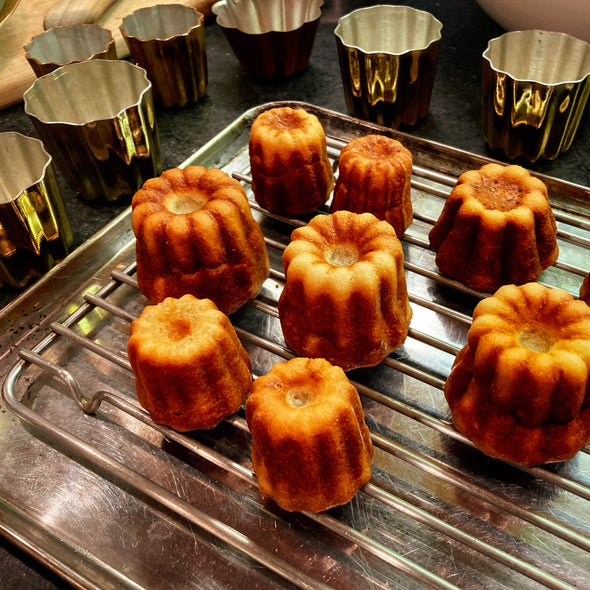 fresh baked caneles with copper molds